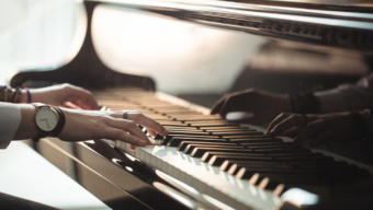 Woman playing a piano in music studio